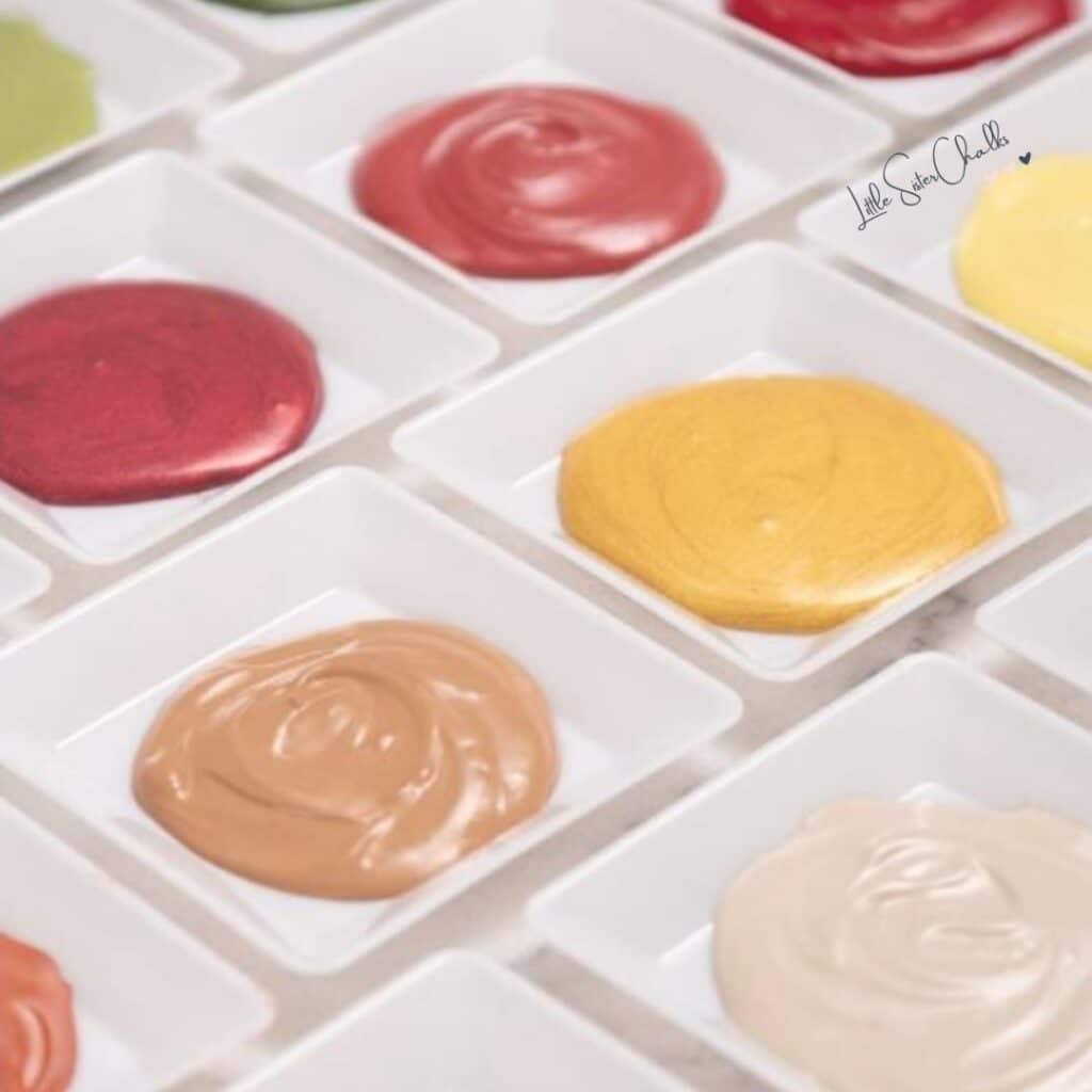 Chalk Couture Paste in red, yellow and cream colors in color trays for blog post Chalk Couture Paste & Ink Guide