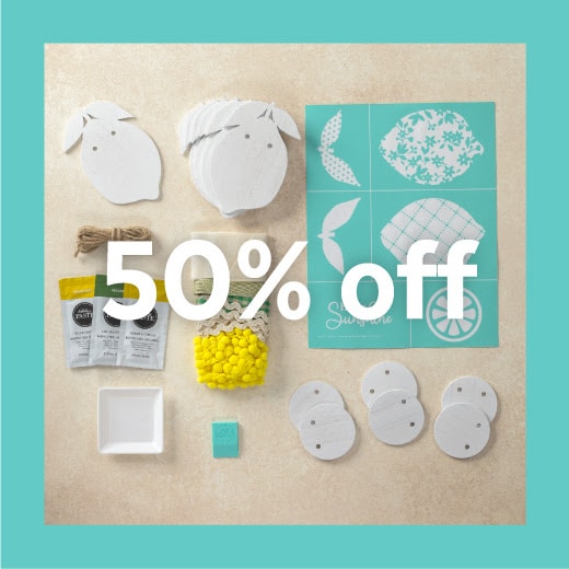 Lemon Garland kit contents including lemon cut outs, lemon stencil, twine, 3 paste packs, ribbon, color tray, squeegee and lemon slice cut outs with words "50% off" across the image for blog post Chalk Couture Black Friday Deals