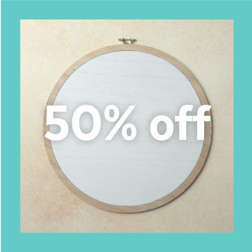 Wood faux embroidery hoop with light colored wood around the edge and white wood in the center with words "50% off" across the image for blog post Chalk Couture Black Friday Deals