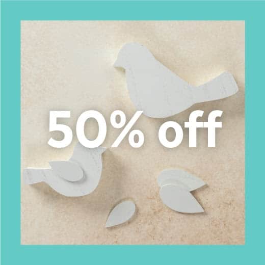 A large and a small white wooden bird cutout with 3 wing cutout pieces with words "50% off" across the image for blog post Chalk Couture Black Friday Deals