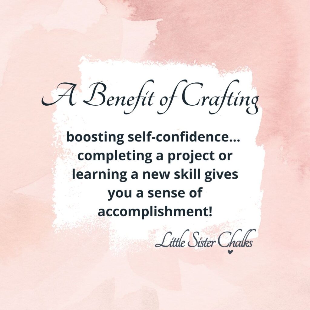 A quote - "A Benefit of Crafting... boosting self-confidence... completing a project or learning a new skill gives you a sense of accomplishment! ~Little Sister Chalks" on a pink watercolor background for the blog post "The Benefits of Crafting - Why Crafting is Good for You & Your Brain"