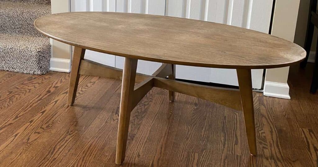 A plain mid-century modern coffee table in a medium brown wood tone for the blog post "Lending a Helping Hand with Crafts for Charity".