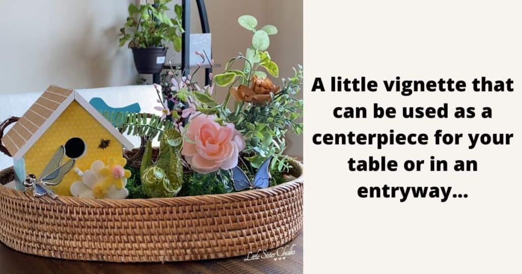 A photo on the left of a little vignette that can be used as a centerpiece for your table in an entryway which includes a woven tray, a ChalkCouture birdhouse with a yellow polka front, blue sides and camel roof embellished with white and yellow felt flowers and a gold bee charm, surrounded by bird figurines, a dragonfly, a butterfly and a small mason jar with faux flowers for the blog post "Birdhouse Decor Isn't Just for Your Garden."