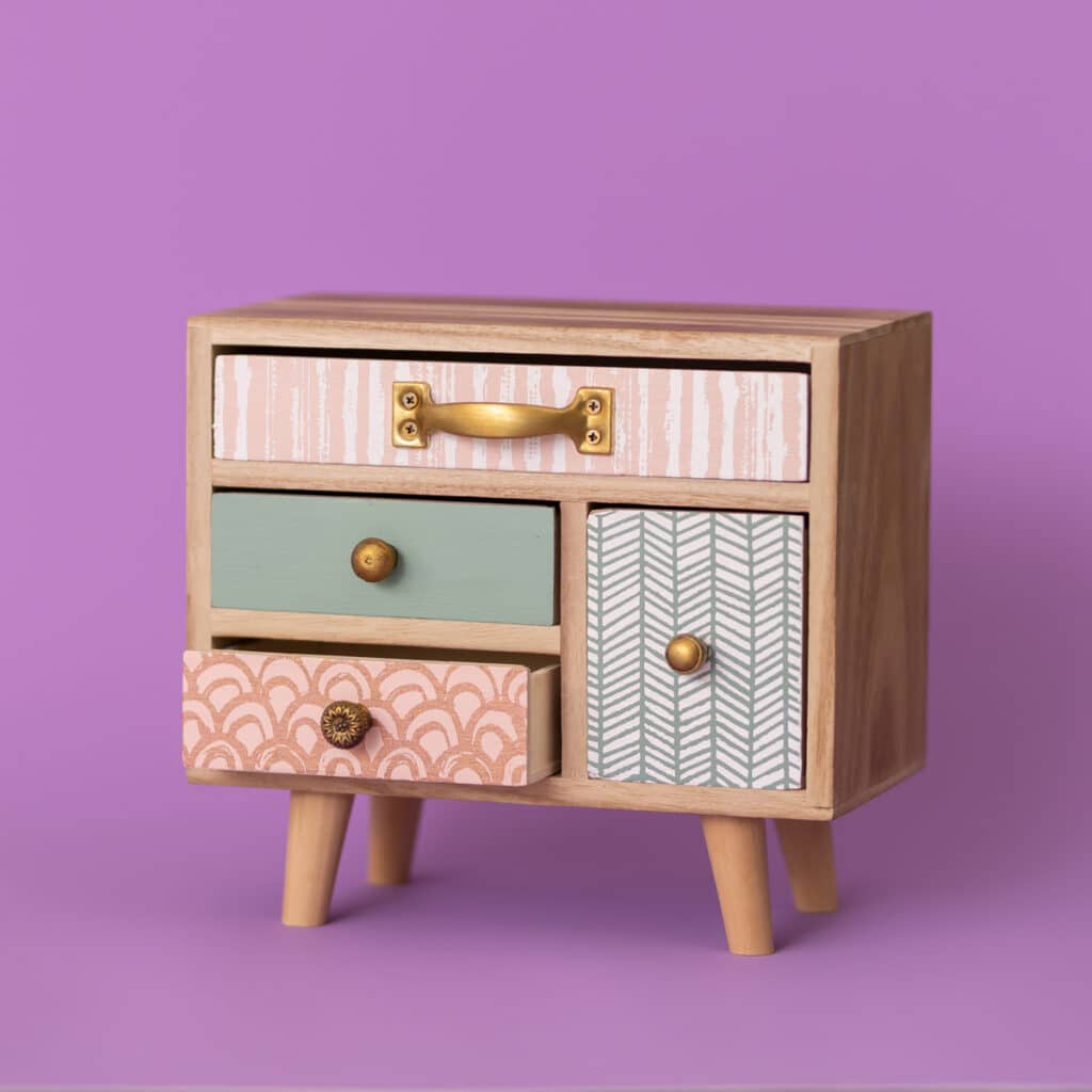 A small side table with 4 drawers featuring patterns from the Chalk Couture Bold Patterns design for the blog post "2024 Creative Kickstart Collection".