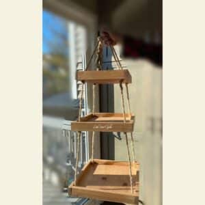 A three tiered wood hanging shelf for the blog post "Give a Tiered Shelf New Life".
