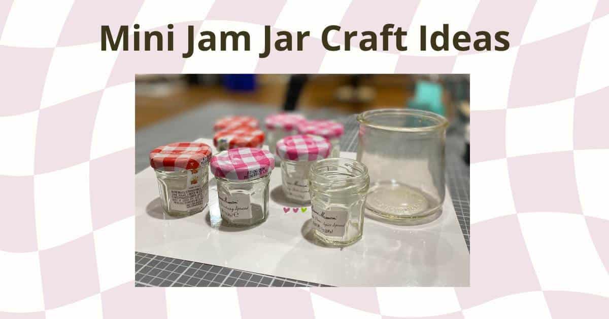 A photo of empty mini jam jars with red and pink lids and a Oui jar on a craft table over a pink and white checkerboard pattern for the blog post "Mini Jam Jar Craft Ideas".