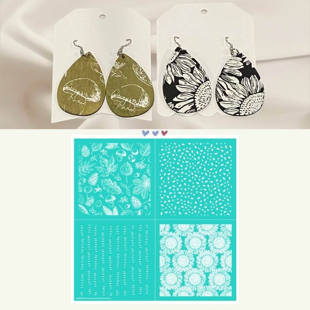 Two pairs of wooden teardrop earrings decorated with Chalk Couture products on a white fabric background: 1 pair is a green background with mushroom designs and 1 pair is a black background with sunflower designs; both designs come from the Chalk Couture Fall Favorite Patterns stencil for the blog post "Elevate Your Style with Wearable Art Earrings featuring Chalk Couture".