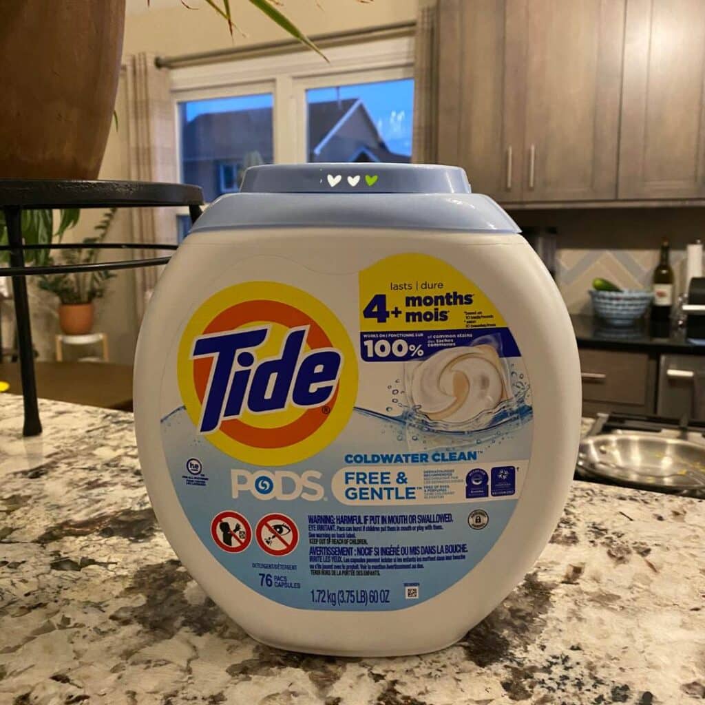 A photo of a Tide Pod Free & Gentle container on a granite kitchen counter top for the blog post "Three Easy DIY Pumpkin Crafts".