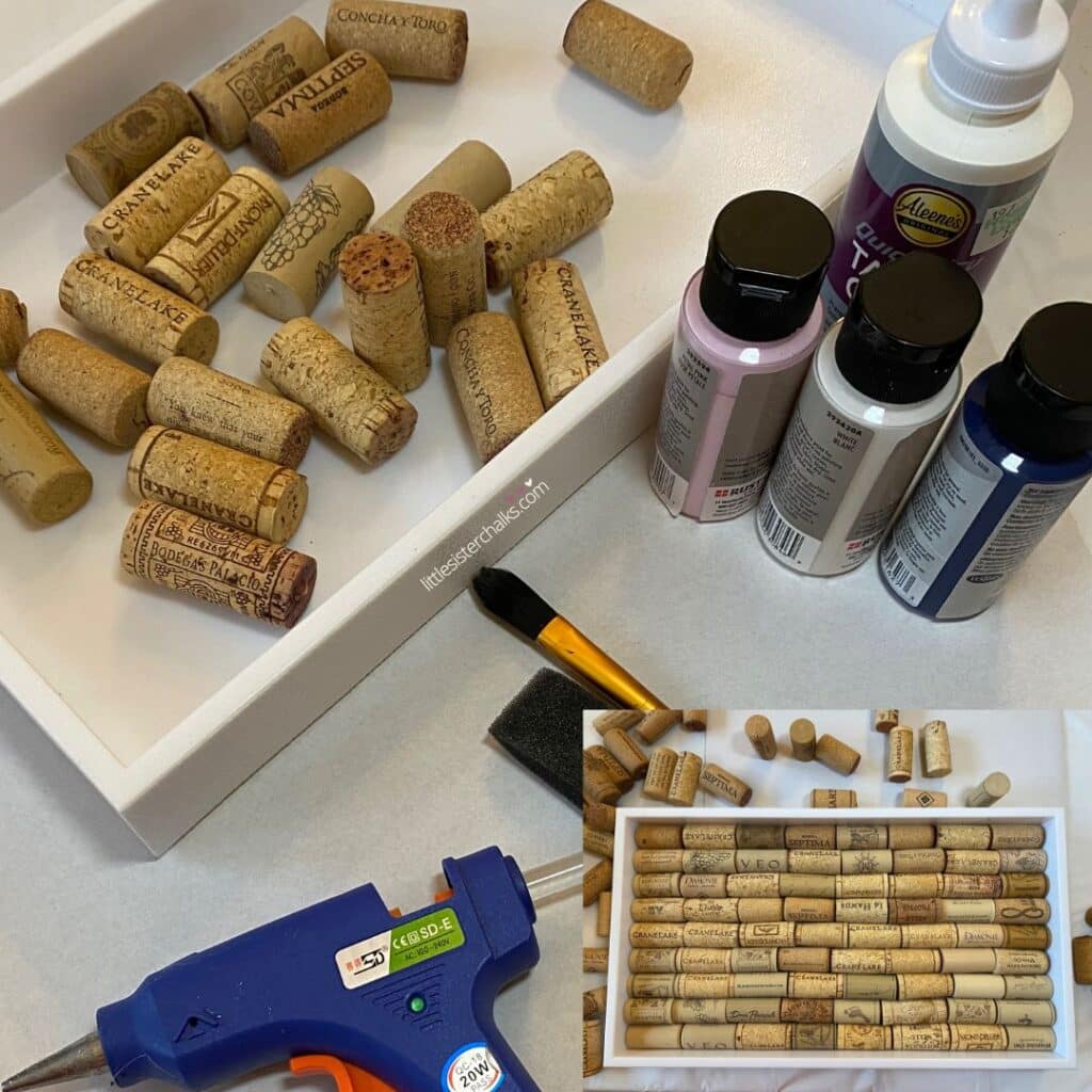 Wine corks sitting in a white tray flanked by acrylic paint in pink, white and navy, a bottle of glue, a paint brush a foam brush, and a hot glue gun, with an inset of the white tray filled with wine corks, for the blog post "Create a Chic Wine Cork Board in 5 Easy Steps".