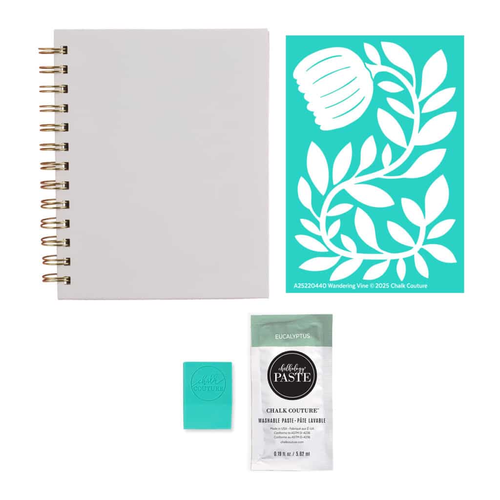 A photo of the contents of the Chalk Couture Wandering Vine Try Me Kit including the Wandering Vine stencil, a white notebook, a packet of Eucalyptus Chalkology Paste and a squeegee for the blog post "Try your hand at chalking with a Chalk Couture Try-me Kit".