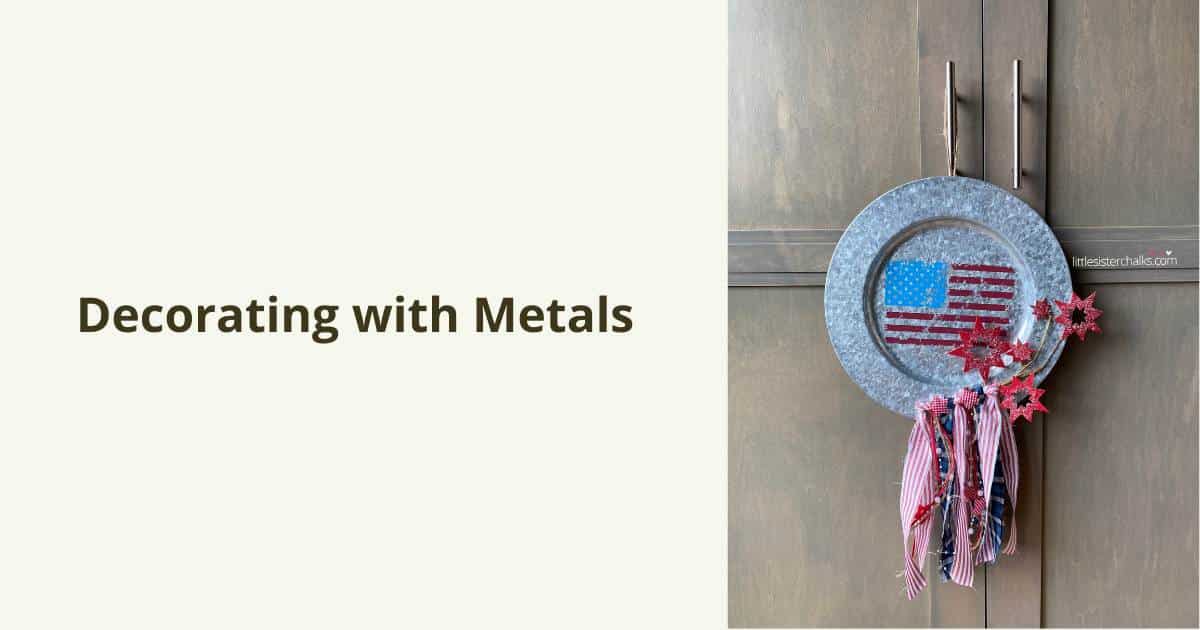 A photo of a metal charger with a United Stated flag chalked in the center and fabric ribbons on sparkers attached to the bottom right flanked by the words "Decorating with Metals".