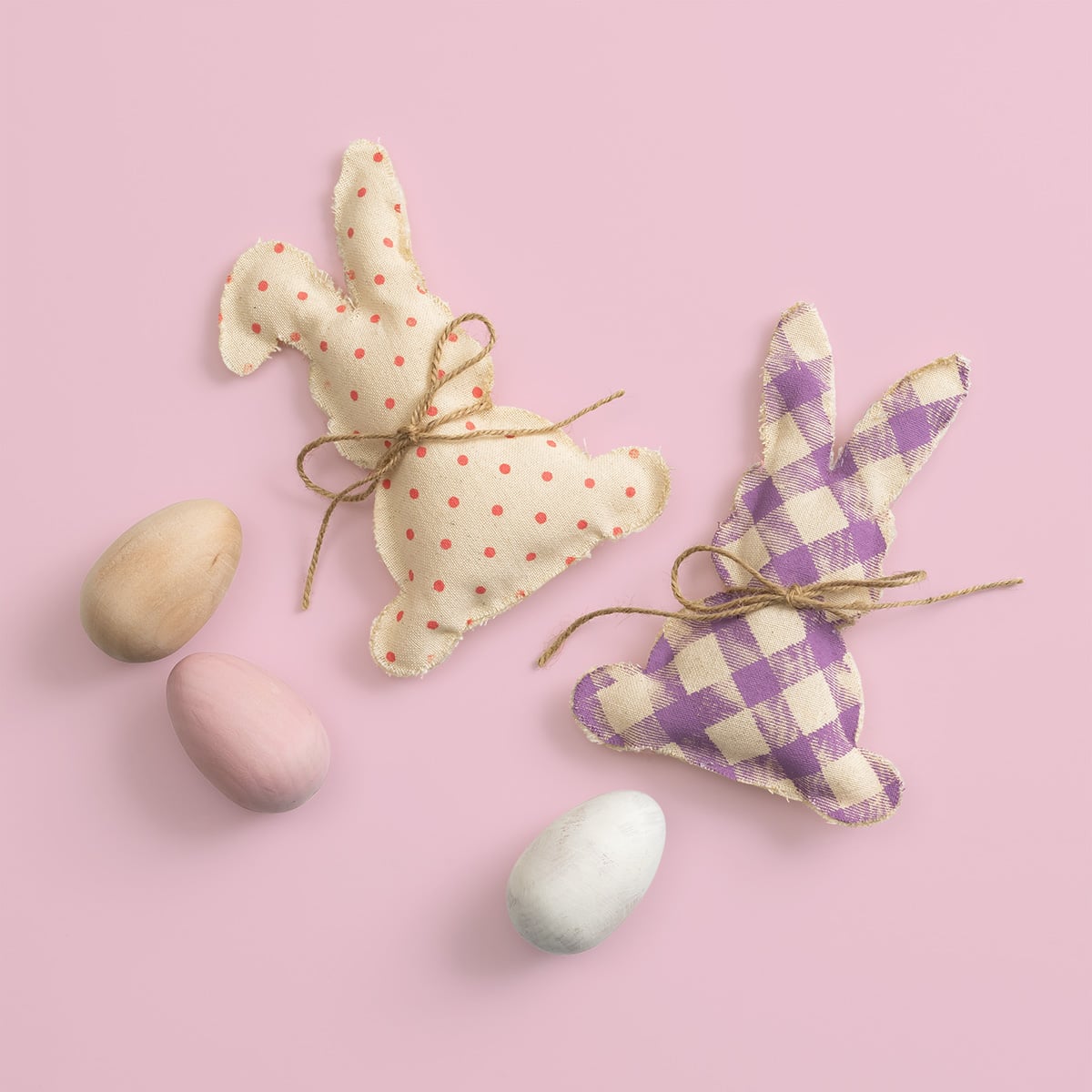 See Chalk Couture's Club Couture finished February 2026 project including two stuffed bunnies done in Couture Coral polka dots and Berry plaid patterns flanked by three wood eggs in natural, pink and white.